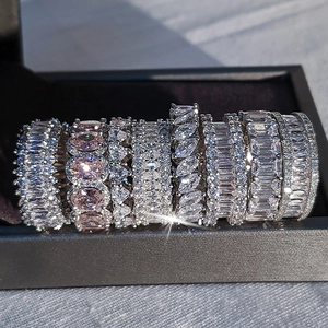 Close-up of luxury eternity rings with emerald, pear, and marquise cut cubic zirconia