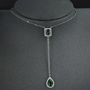 Elegant Y-shaped necklace with emerald-cut green zircons and pear-shaped pendant drop