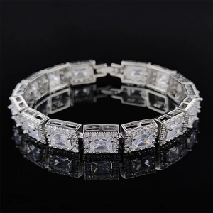Detailed close-up of silver-plated bracelet with rectangular cubic zirconia and halo stones