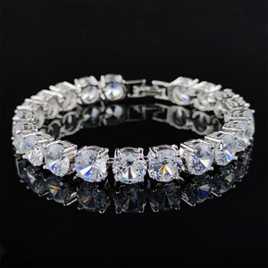 Close-up of silver tennis bracelet with round cubic zirconia in claw setting