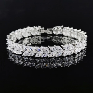 Silver leaf bracelet with marquise cut zircons and folding clasp on black background