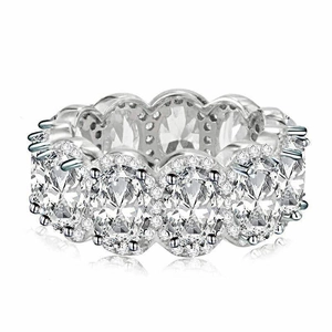 Luxury eternity ring with oval-cut cubic zirconia and sparkling halo setting on silver band
