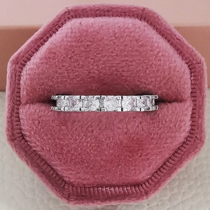 Sparkling silver eternity ring with rows of diamonds in a pink velvet jewelry box
