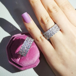 Detailed view of luxurious wide eternity rings with marquise cut cubic zirconia diamonds