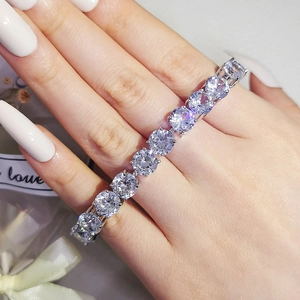 Sparkling S925 silver tennis bracelet with round brilliant cut stones worn on wrist