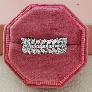 Macro shot of a luxury marquise-cut zircon leaf ring in a pink velvet jewelry box