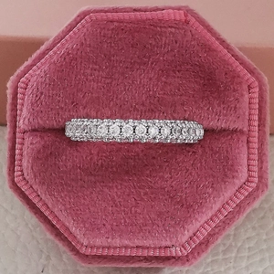 Three-row micro-pave silver ring with sparkling cubic zirconia in a pink velvet box
