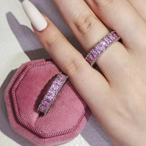 Sparkling pink rectangle-cut zircon eternity ring with elegant pink velvet gift box