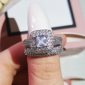 Macro detail of luxury silver ring set with square center stone and pavé zircon stones