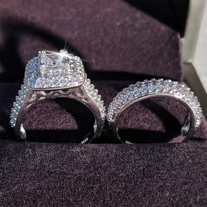 Detailed macro of S925 silver wedding ring set with princess cut cubic zirconia in velvet box