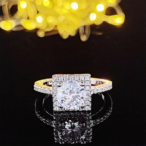Macro shot of a champagne square halo engagement ring with brilliant silver accents