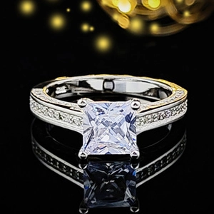Macro shot of S925 sterling silver ring featuring a princess cut diamond and fine engraving