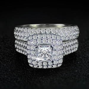 Luxury silver bridal ring set with princess cut center stone and pavé diamond detailing