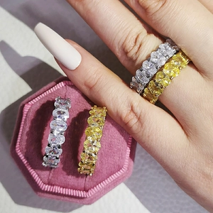 Elegant silver and gold oval-cut 3A zircon engagement rings in a luxury velvet gift box