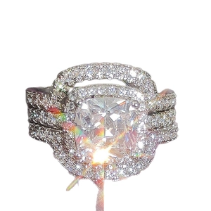 Luxury three-in-one cushion cut wedding ring set with sparkling side stones and silver finish