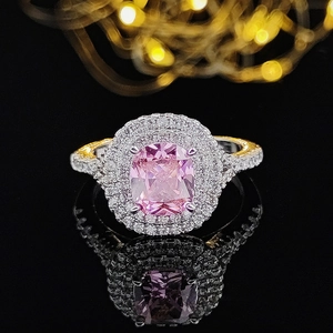 Anillo de lujo con gran circón rosa, doble halo y pavé sobre banda de color plata