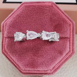 Elegant silver ring with pear and square cut moissanite diamonds in pink velvet box