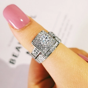 Close-up of sparkling silver halo engagement ring set with round cubic zirconia stones