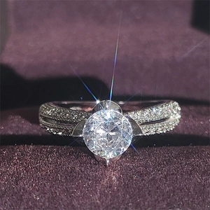 Vintage style wide band engagement ring with round center stone and pavé diamonds