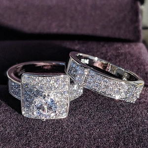 Luxury silver-tone halo engagement ring set with round zirconia in a purple velvet box