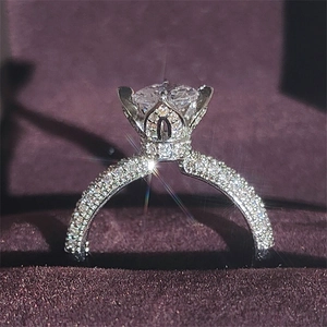 Vintage floral crown engagement ring with pavé diamonds in a velvet jewelry box