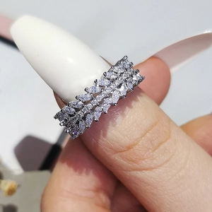 Detailed close-up of luxurious triple-row marquise and round cut zircon silver ring