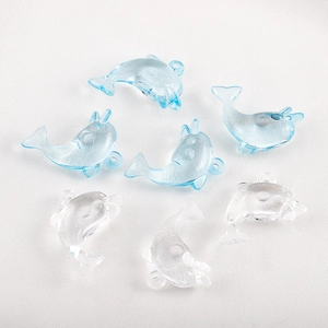 Close-up of blue and clear resin dolphin charms for DIY jewelry making set of six pieces