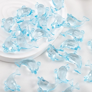 Blue transparent resin dolphin pendants for DIY jewelry making on white display base