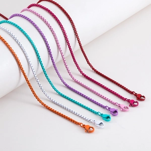 Close-up of colorful matte box chains with matching lobster clasps for DIY jewelry