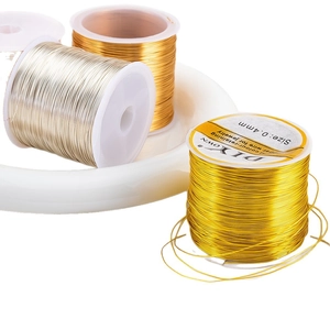 DIY jewelry making copper wire in gold and silver 0.4mm spools on white display