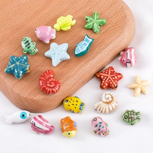 Detail of colorful polymer clay ocean animal beads including sea stars and turtles for DIY