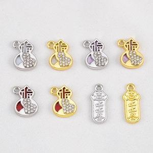 Macro detail of alloy gourd charms with Fu character and sparkling crystal rhinestones