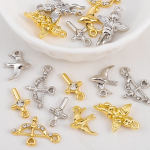 DIY jewelry charms including Cupid arrow, angel and crystal cross in gold and silver
