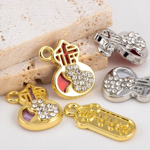 Alloy gourd pendants with Fu character and rhinestones in gold and silver finishes