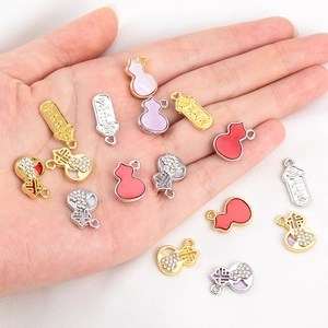 Detailed view of alloy gourd charms with Fu character and rhinestones for DIY jewelry