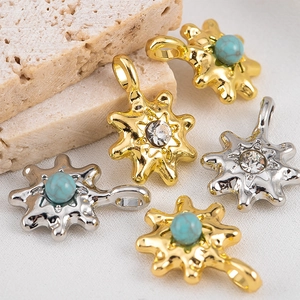 Detailed view of alloy star pendants with turquoise beads and inlaid rhinestones