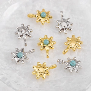 Detailed macro view of gold and silver hexagram pendants with turquoise stones