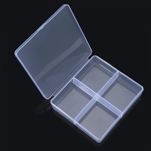 Close-up of a 4-compartment transparent plastic organizer box for jewelry and parts