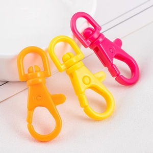 Detail of candy-colored plastic lobster clasps with 360-degree swivel rings for DIY crafts