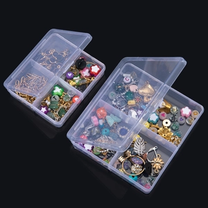 Overhead view of transparent PP plastic storage boxes with multiple compartments and beads