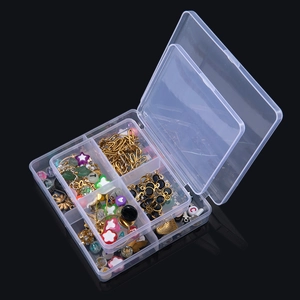 Detailed view of clear PP storage box filled with colorful DIY beads and gold metal buckles