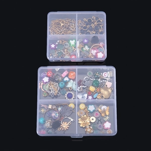 Close-up of 4-compartment transparent organizers with colorful beads and metal findings