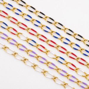 Detail of gold oval link chains with colorful enamel dripping for DIY jewelry making