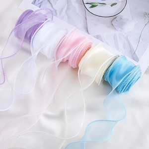 Close-up of translucent organza ribbon rolls for bouquet and gift packaging