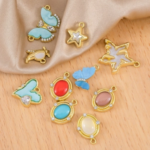 DIY jewelry charms in butterfly, heart, and star shapes with gold plating and rhinestones