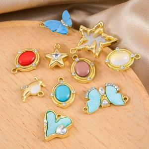 DIY gold alloy charms set featuring heart star and butterfly shapes with colorful stones