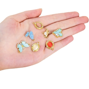 Set of gold alloy heart and butterfly pendants with blue enamel and micro-pavé crystals