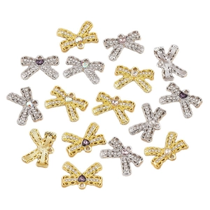 Bow tie jewelry charms with heart-shaped crystals in gold and silver finish