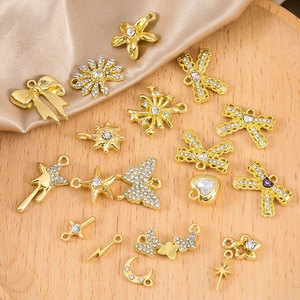 Assorted gold alloy butterfly and heart pendants with rhinestones for DIY jewelry making