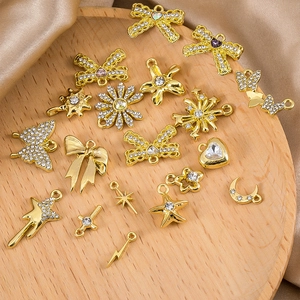 Assorted gold alloy butterfly and heart charms with rhinestones for DIY jewelry making